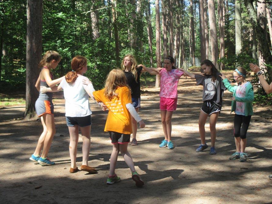 Girls participating in fun fitness activities at summer camp
