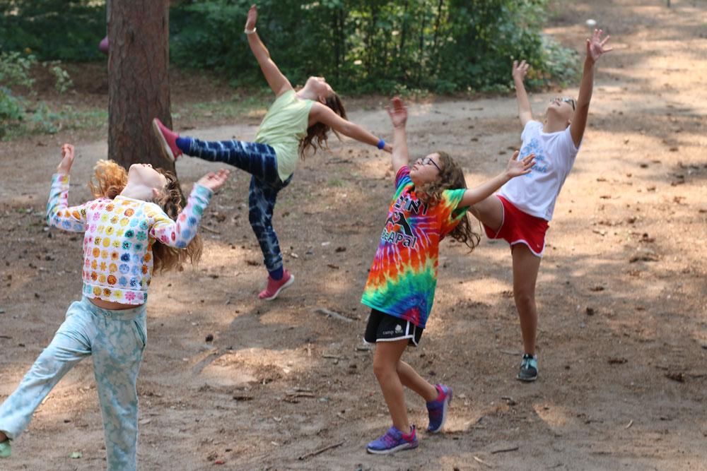 Children participating in a dance workshop at a performing arts camp