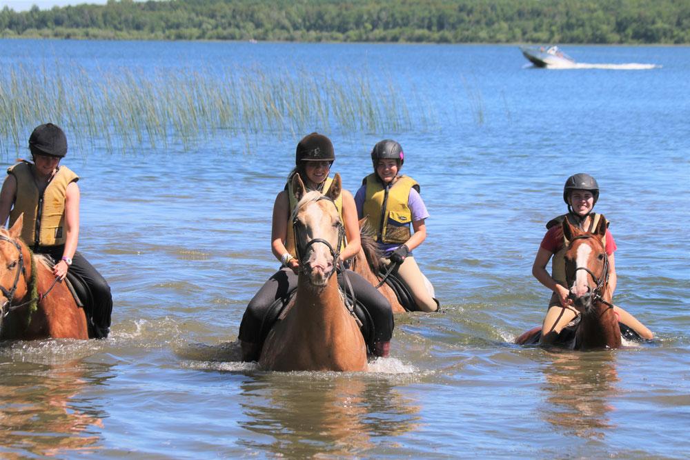 campers riding horses at Camp Kamaji in Minnesoa