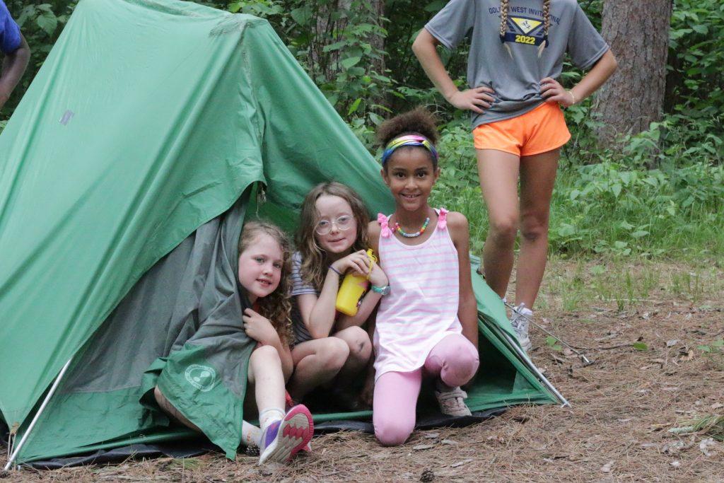 Girls hiking and engaging in outdoor activities at camp