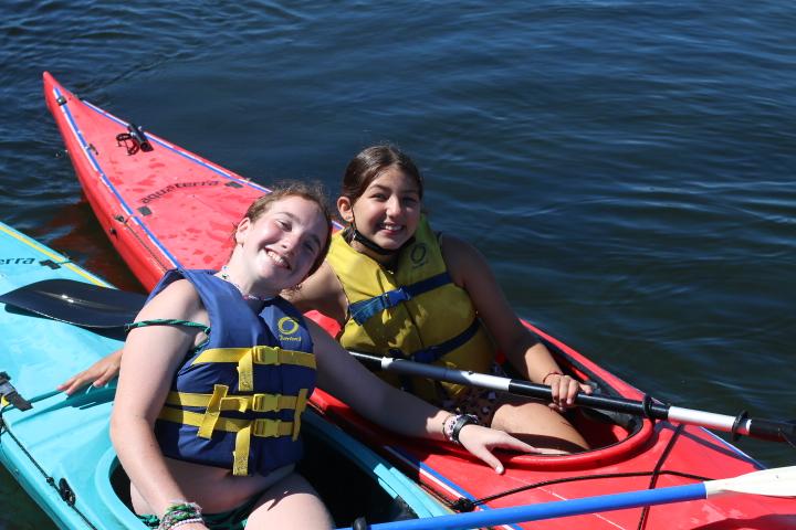 Girls preparing for kayaking and paddling adventures