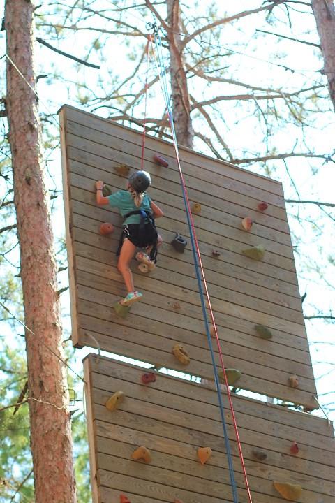 Campers challenging themselves and mastering new skills at summer camp