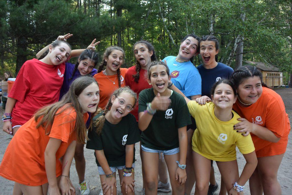 Teens collaborating and developing teamwork skills at camp