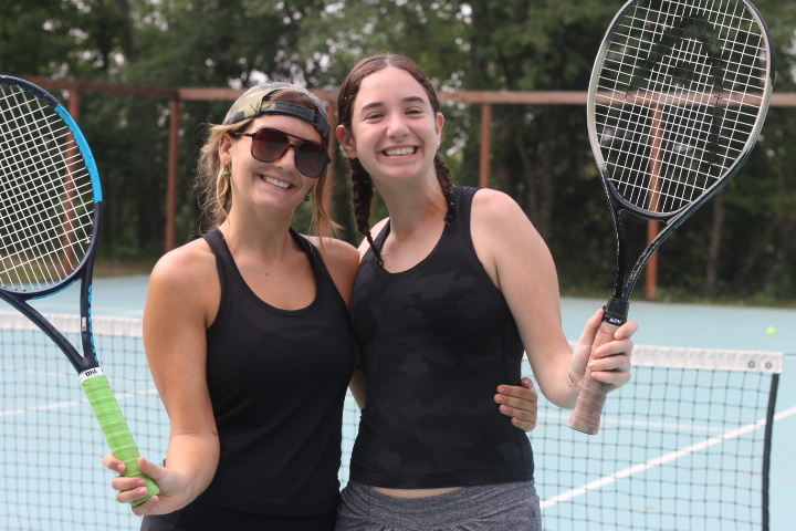 Girls playing tennis and forming new friendships